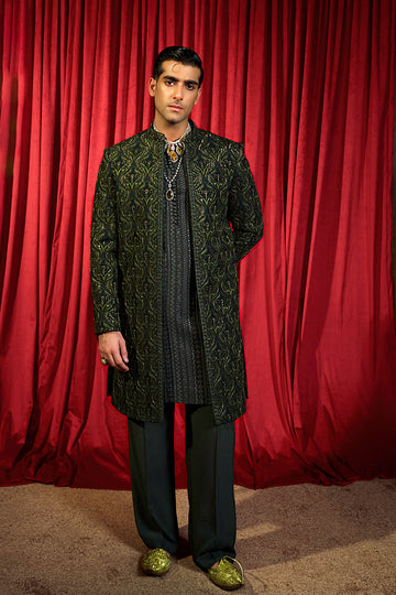 Shop designer embroidered green sherwani for groom with intricate gold detailing, available for online purchase. Perfect traditional attire for weddings and special occasions.